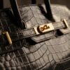 Hérmes black color crocodile leather BADGE